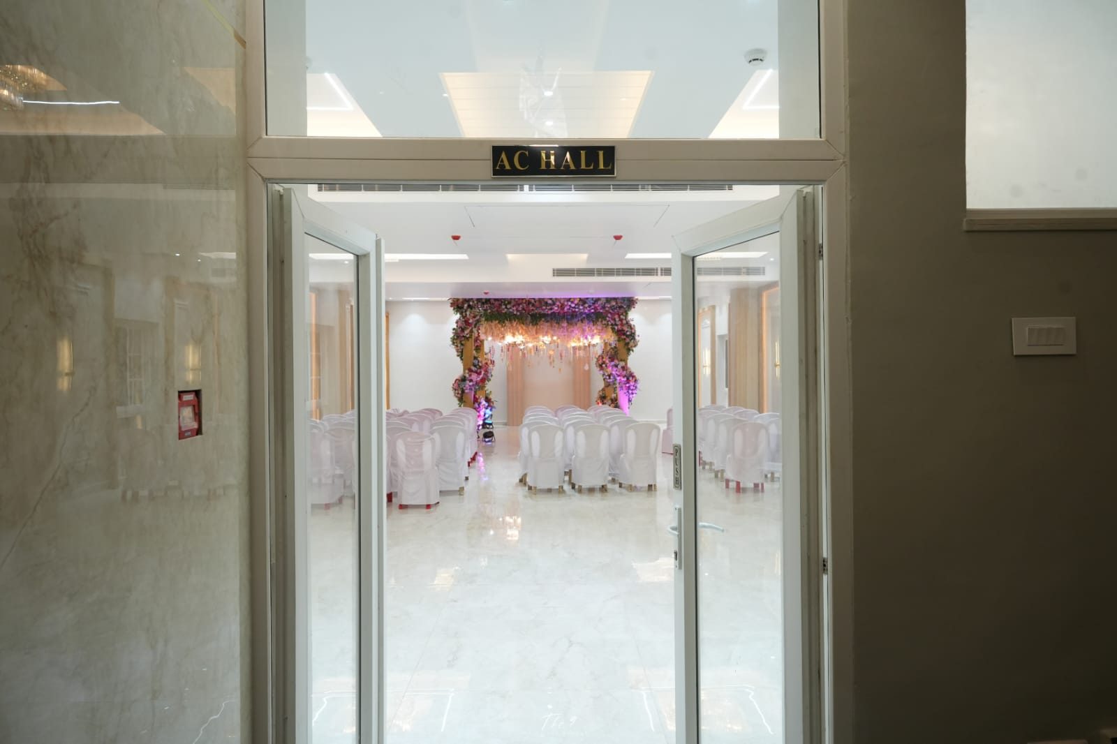 Glass doors opening into the air-conditioned banquet hall