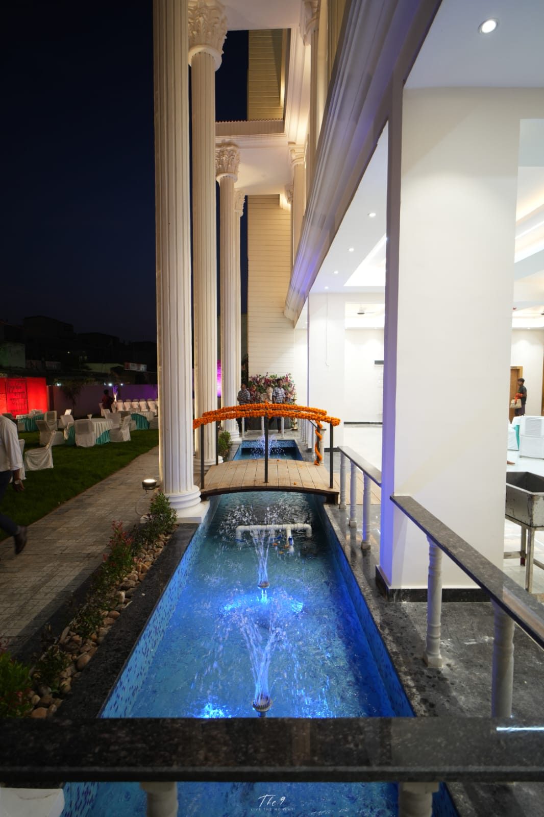 Lit water feature beside the Aarambh Banquet building
